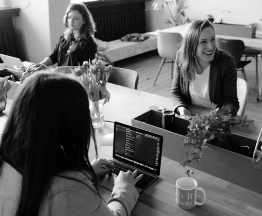 Three women working in an office